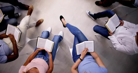 Photo of group of adults reading