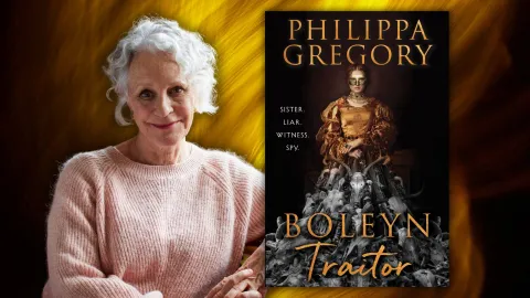 Philippa Gregory seated next to her book Boleyn Traitor