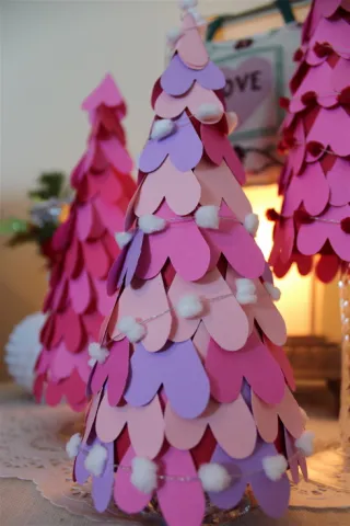 Cone covered in pastel hearts and a pom pom garland