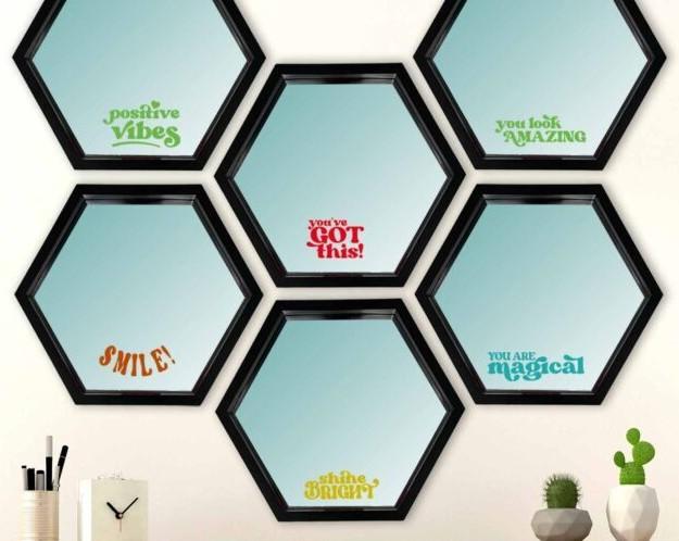 mirrors displaying positive messages made from brightly colored vinyl